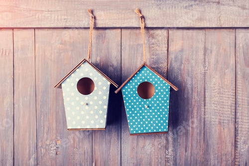 Preview: Two Birdhouses Hang On With Antique Rustic Wood Background.