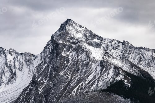 Preview: Big mountain peak with snow covered and overcast sky