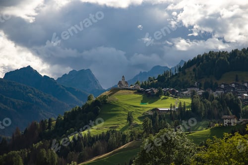 Preview: Rocca Pietore village, with his small church located at the foot of the Marmolada, Dolomites