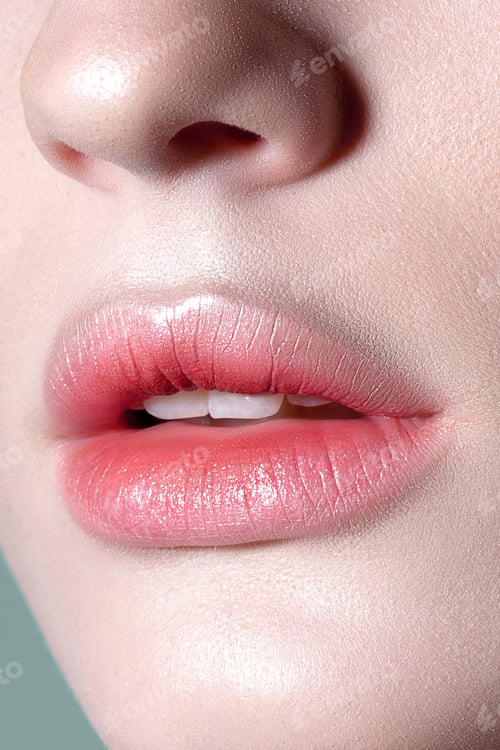 Preview: Lips of young sensual woman with clear glowing skin closeup