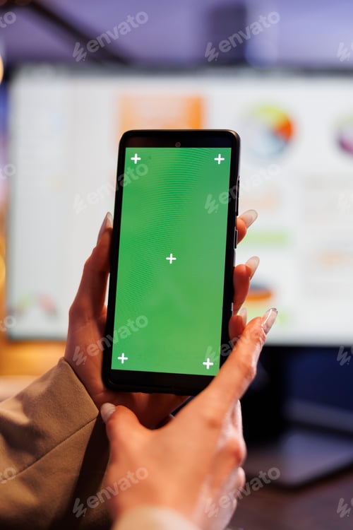 Preview: Executive manager holding green screen chroma key mock up mobile phone