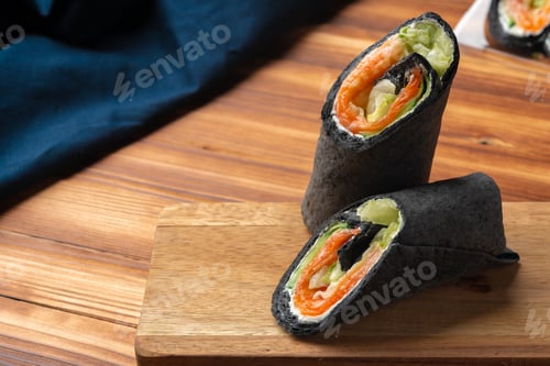 Preview: Black tortilla wrap with salted salmon and vegetables