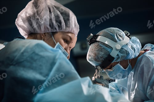 Preview: Surgical team in the operating room, close-up. An international team of professional doctors in a