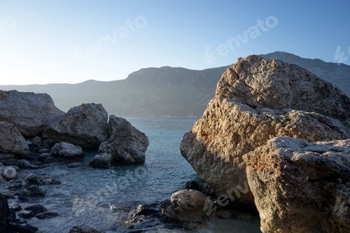Preview: Beautiful rocky cliffs and clear ocean water.
