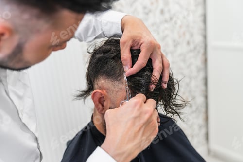 Preview: Hair transplant doctor preparing patient for hair implant procedure