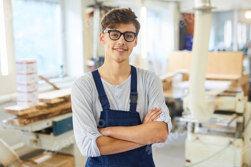 Preview: Smiling young joiner in uniform