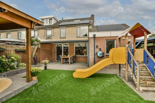 Preview: Neat patio with sitting area with playground
