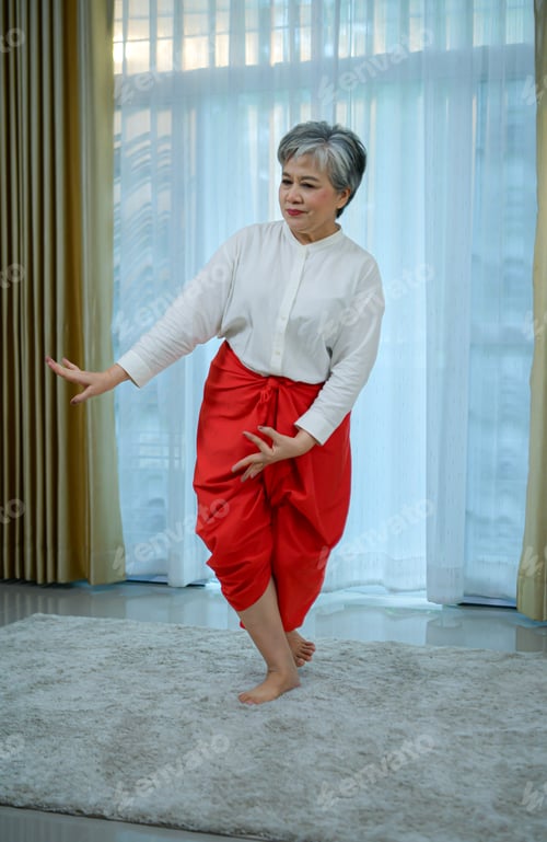 Preview: Elderly women relax by practicing traditional Thai dance.