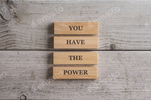 Preview: Stack of four wooden pegs with a You have the power sign on them