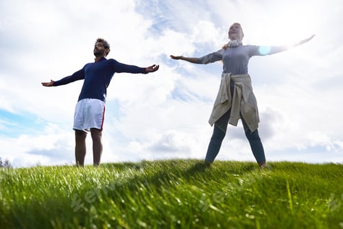 Preview: Couple Exercising on Green Hill with Blue Sky