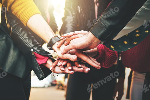 Preview: Group of people joining hands in stack