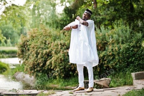 Preview: Rich black man at white national dress