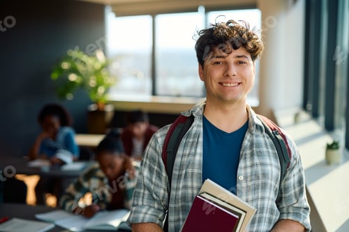 Preview: Portrait of happy college student in the classroom looking at camera.