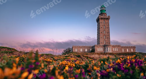 Preview: Beautiful view of the lighthouse in Cap Frehel peninsula during sunset in Brittany, France
