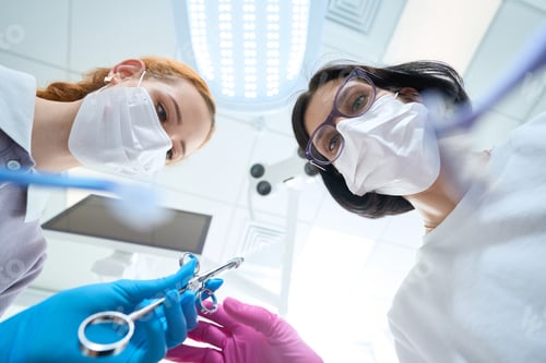 Preview: Assistant gives a syringe to a woman doctor