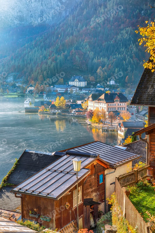 Preview: Amazing foggy autumn sunrise on famous Hallstatt mountain village with Hallstatter lake.