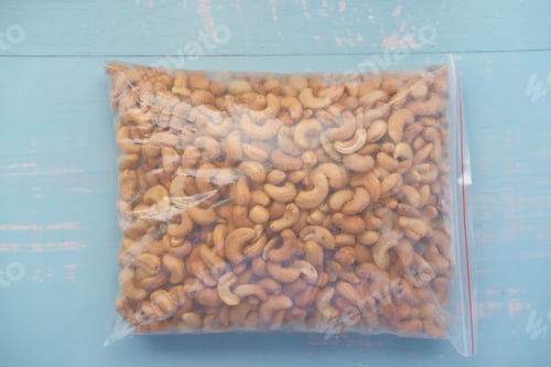 Preview: cashew nuts in plastic bag on table