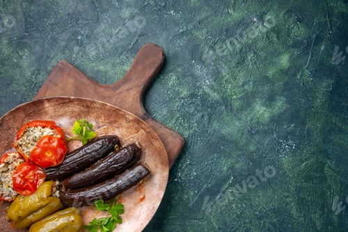 Preview: top view tasty vegetable dolma on a dark blue background food dish oil cook cuisine meal color