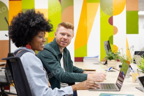Preview: Diverse coworkers collaborating in modern office environment