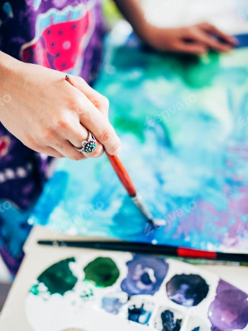 Preview: Close up on hand painting with brush