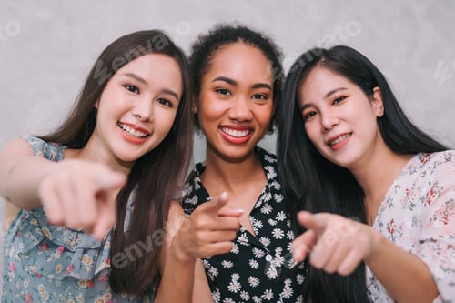 Preview: Group of multi ethnic woman pointing at camera in exciting and happy emotion.