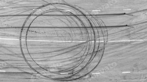 Preview: Aerial view tire track mark on asphalt tarmac road race track texture and background.