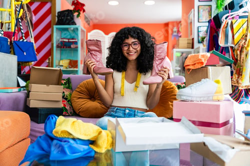 Preview: Beautiful young hispanic woman managing her home e-commerce business from home