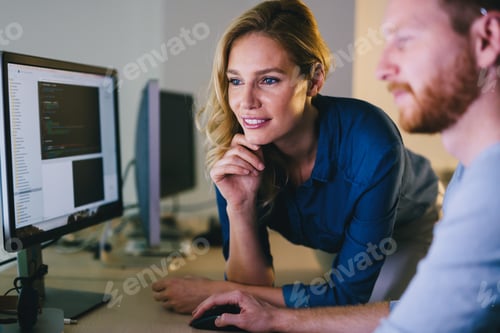 Preview: Programmers cooperating at information technology company