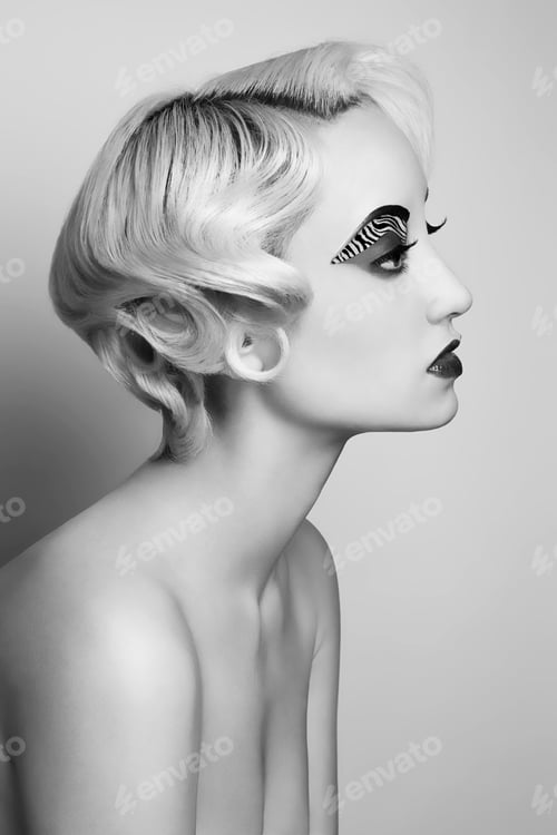 Preview: Black and white portrait of a woman with vintage hairstyle and dramatic makeup.