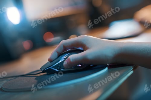 Preview: Gamer hand on the mouse close up