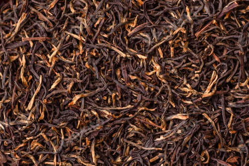 Preview: Golden black tea, dried leaves of a Chinese or Indian breakfast drink. Black tea dried leaves