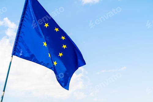 Preview: European Union flag against blue sky waving