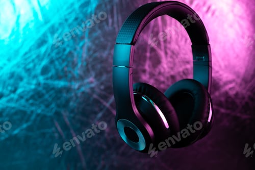 Preview: Retro 90s style photo of black stylish wireless headphone in neon lights.