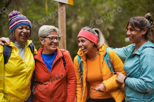 Preview: Multiracial women having fun together during trekking day in the forest