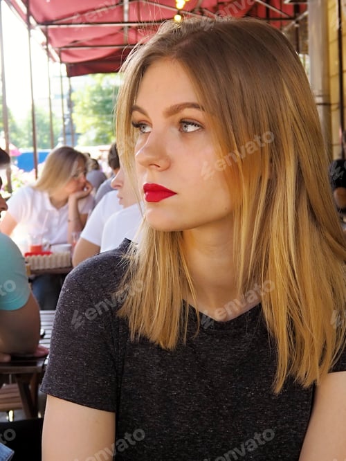 Preview: NOMINATED!! Portrait. Blonde girl in the summer in a street cafe