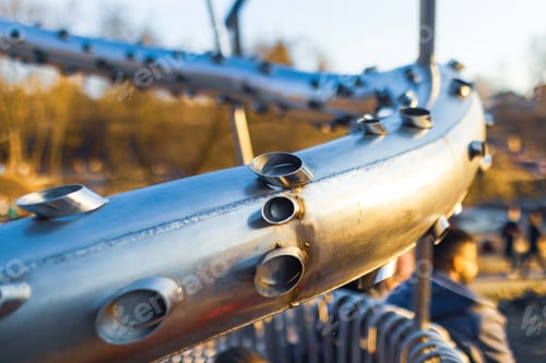 Preview: Close-up street bench metal pipes arranged parallel