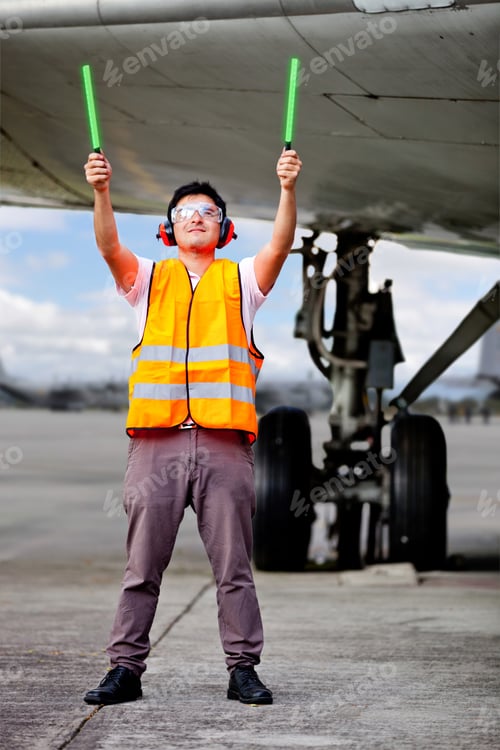 Preview: Air Traffic Controller Holding Light Signs At The Airport