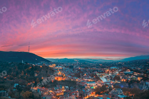 Preview: Tbilisi, Georgia. Elevated Rooftop View Of Georgian Capital City Skyline Cityscape In Evening
