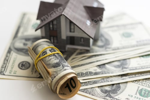 Preview: Miniature House on Stack of Hundred Dollar Bills
