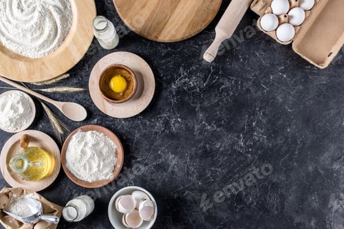 Preview: flay lay with arranged bread bakery ingredients and kitchenware on marble tabletop