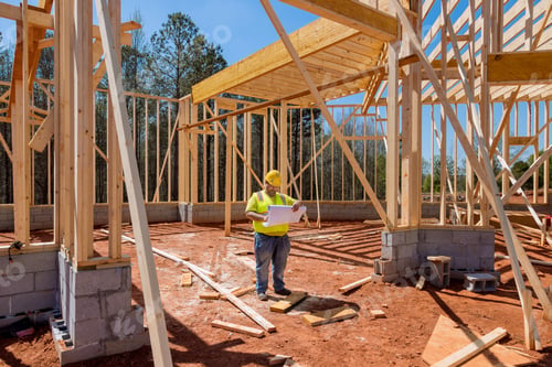 Preview: Construction work is being carried out at the building site by a contractor using a blueprint plan