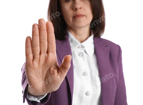 Preview: Woman in suit showing gesture stop on white background, closeup