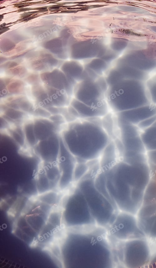 Preview: View of the bottom of a swimming pool with a rippled light effect