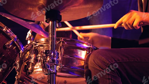 Preview: Drummer plays on drum set and cymbal with drumsticks on the stage