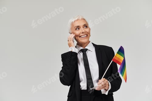 Preview: Confident Woman Celebrating Pride While Engaging on Phone in Stylish Attire