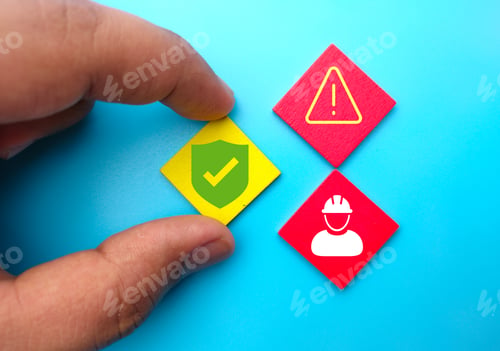 Preview: Close-up shot of a hand holding colorful wooden rhombuses with a worker, caution, and safety icons