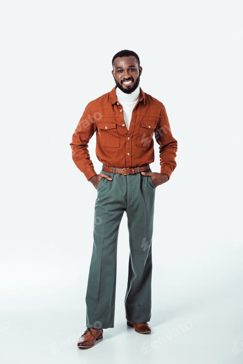 Preview: happy african american retro styled man looking at camera on white