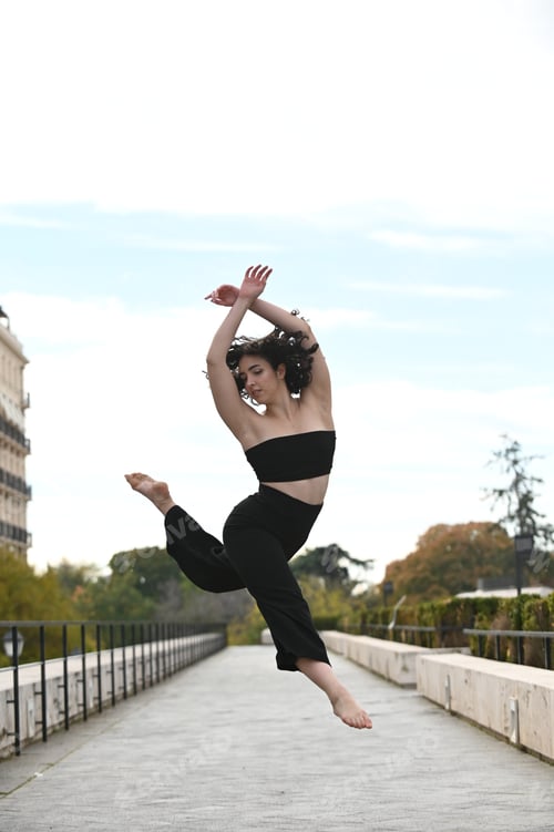 Preview: Beautiful ballerina dancing on street in the city