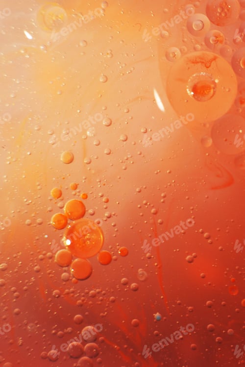 Preview: Gold and red Oil bubbles close up. circles of orange and pink water macro. abstract shiny background