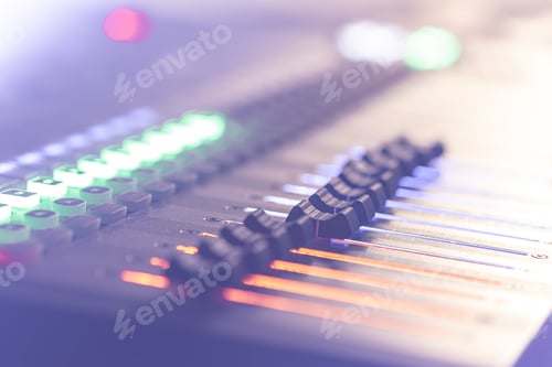 Preview: Professional audio mixing console with faders and controls.